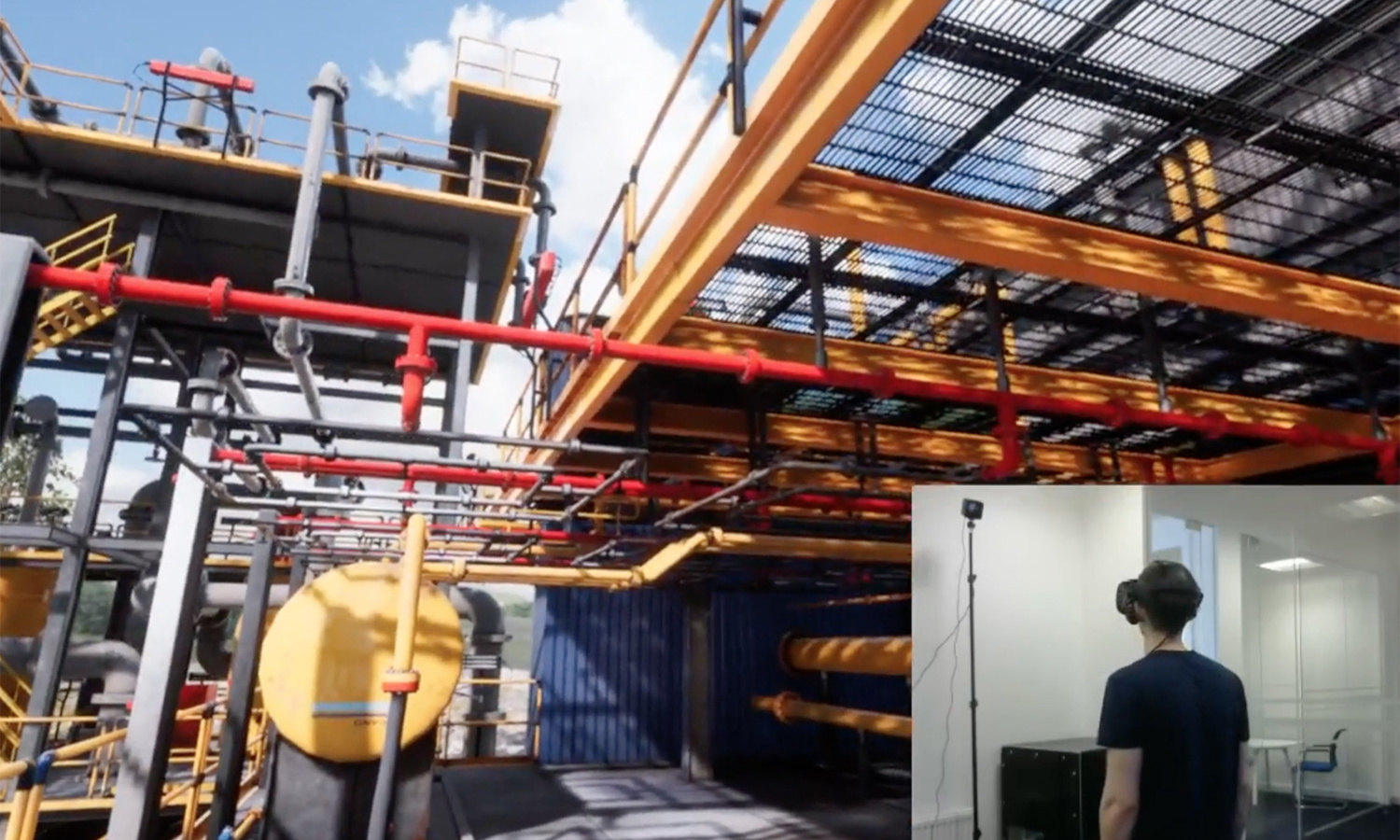 A person wearing a VR headset is immersed in a virtual industrial environment showcasing machinery, yellow tanks, and red pipelines.