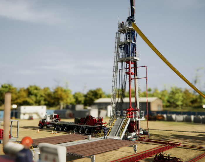An oil drilling rig stands in a grassy outdoor setting, surrounded by equipment and vehicles, with trees and buildings visible in the background.